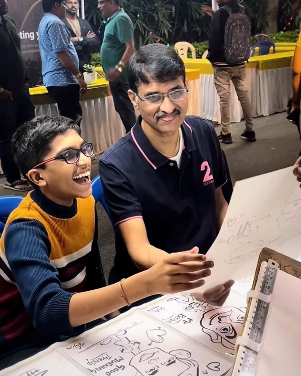 This is what it's all about. That moment of pure joy when someone sees their caricature for the first time is why I love my work. This father and son's reaction at a live event was priceless.