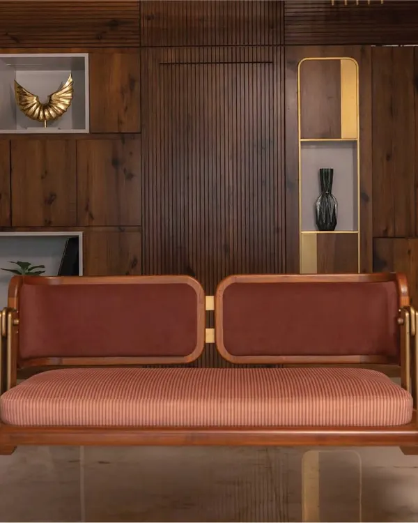 A beautiful reversible swing crafted from rich teakwood and upholstered in a deep rust fabric. The solid frame and brass details ensure it is as sturdy as it is elegant, designed to be a cherished piece in your home for years to come.