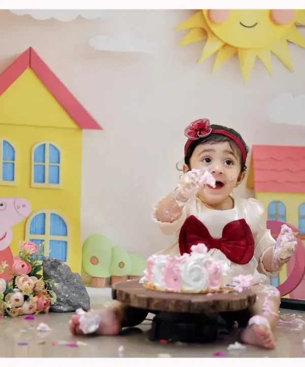 A messy and fun first birthday! This Peppa Pig themed cake smash session is filled with color, laughter, and a delicious cake for your little one to enjoy.
