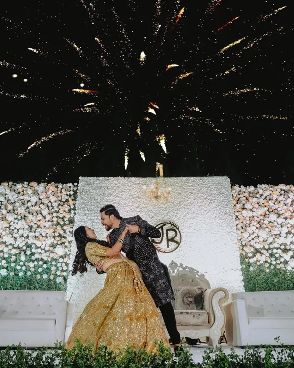 A magical first dance under a sky full of fireworks. I focus on capturing these grand, fairytale moments that make your reception unforgettable.