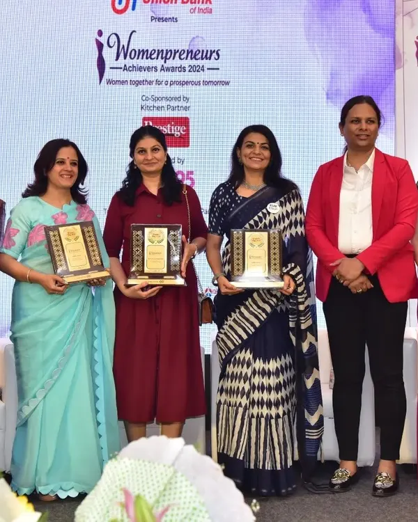 I was so happy to receive the "Womenpreneur Achievers Award 2024" on Women's Day. This picture shows me on stage with other incredible women entrepreneurs, a moment of shared success and inspiration.