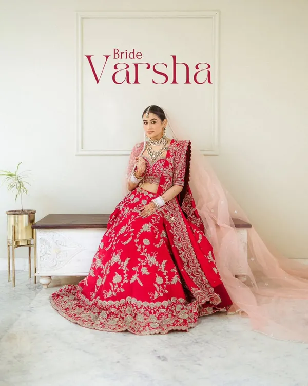 A bridal portrait that feels like a magazine cover. Varsha looks absolutely regal in her red lehenga, a perfect blend of modern style and timeless tradition.