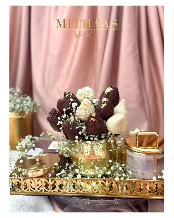 With strawberries and Valentine's Day in season, this chocolate-dipped strawberry bouquet is the perfect romantic gesture. Arranged in a golden vase, it's a gift that is both beautiful and delicious.