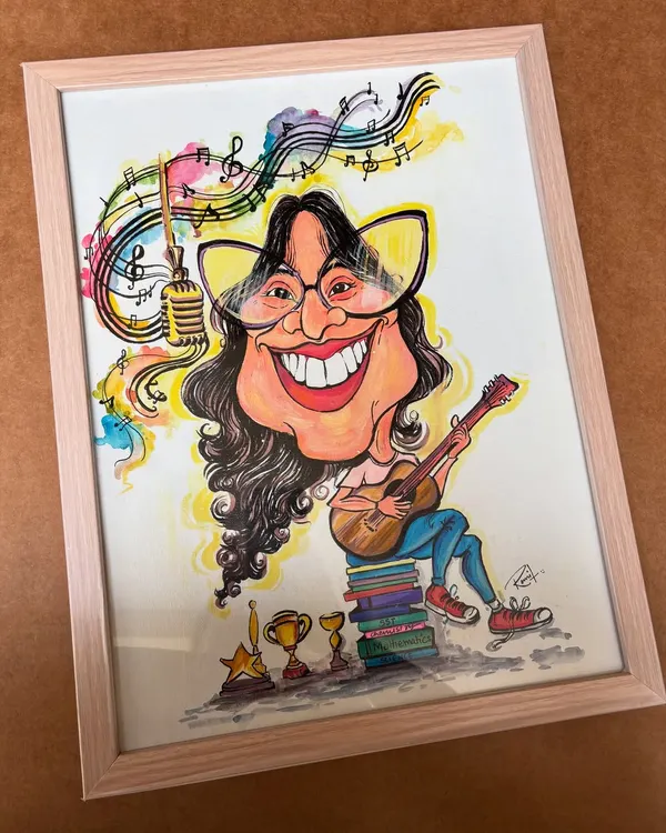 For the true all-rounder! This framed caricature celebrates a girl who excels at everything, from music to academics. I loved incorporating her guitar, books, and trophies into one vibrant portrait.