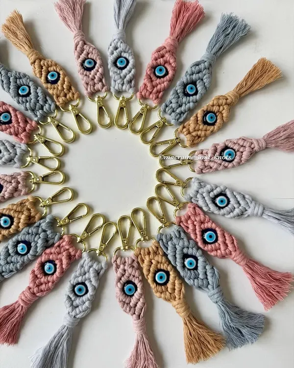 A closer look at the detail in my evil eye macrame keychains. The diamond knot pattern is woven tightly around the central bead, creating a beautiful and durable charm for your keys or bag.