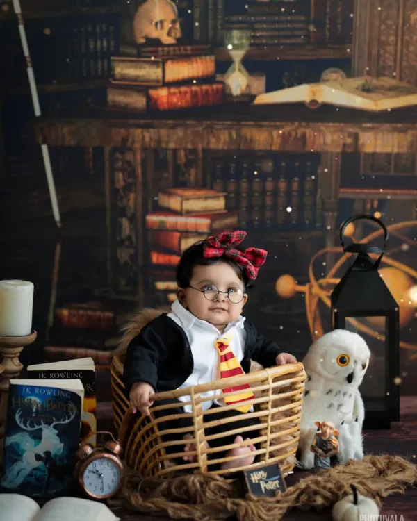 Platform 9¾ is calling! For the little wizard in your life, our Harry Potter themed shoot is a magical experience, complete with a Gryffindor tie, glasses, and a Hedwig look-alike.
