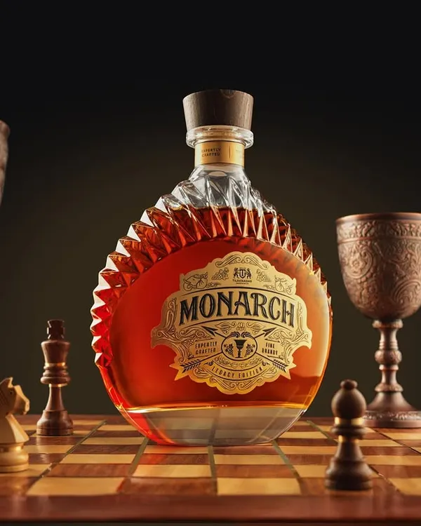 For Monarch brandy, we built a world of strategy and royalty. This conceptual shot places the bottle as the king on a chessboard, surrounded by custom pieces. It’s about creating a narrative of power and legacy, captured entirely in-camera.