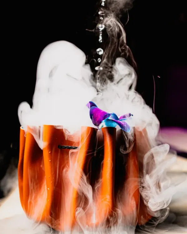 A feast for the eyes and the palate. This cocktail is served in a pumpkin-shaped glass with a dramatic dry ice smoke effect, perfect for adding a bit of theatre.