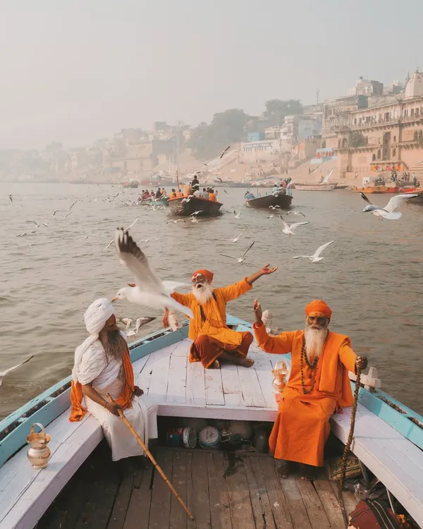 Three sadhus on a boat in the Ganga, surrounded by morning mist and migratory birds. It’s a classic Banaras scene, full of peace and a sense of timelessness.