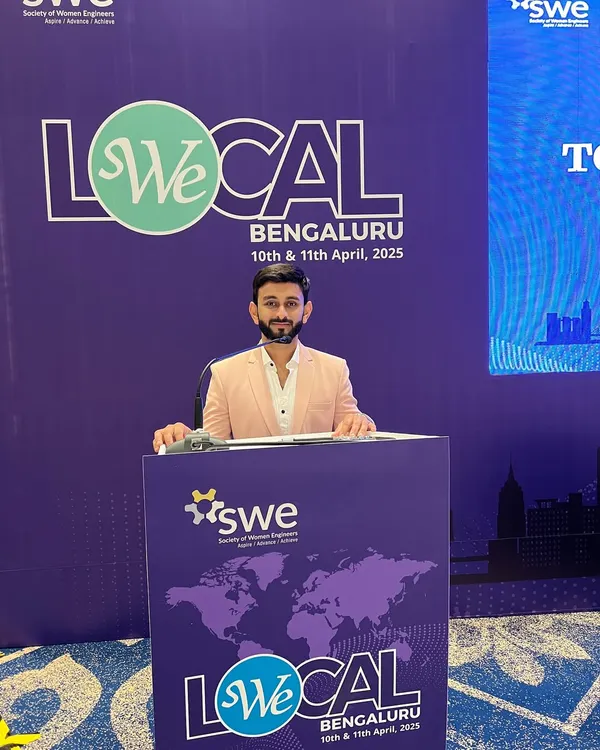 Hosting the We Local Bengaluru conference, a major event for the Society of Women Engineers. My job at the podium is to guide the audience through the agenda with clarity and energy.