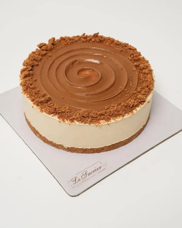 This is my Lotus Biscoff Cheesecake, a crowd favorite. It features a creamy, cold-set cheesecake infused with Biscoff spread, a crunchy Biscoff biscuit base, and a swirl of more Biscoff on top.