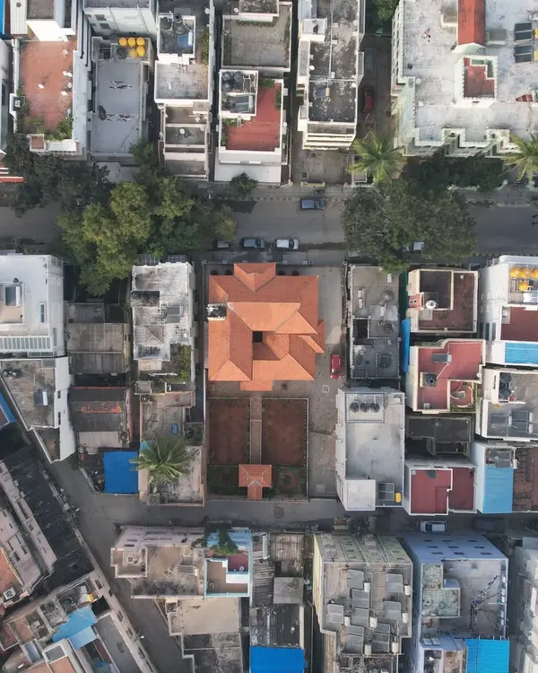 An aerial view showing how the traditional Mangalore tile roof of the Basavanagudi house stands out as a natural element amidst the concrete jungle of the city.