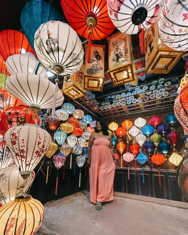 I could stay in this city forever. Hoi An, with its magical lanterns, was the perfect backdrop for this comfortable and chic pink jumpsuit. I can help you plan a vacation wardrobe that is both photogenic and practical.
