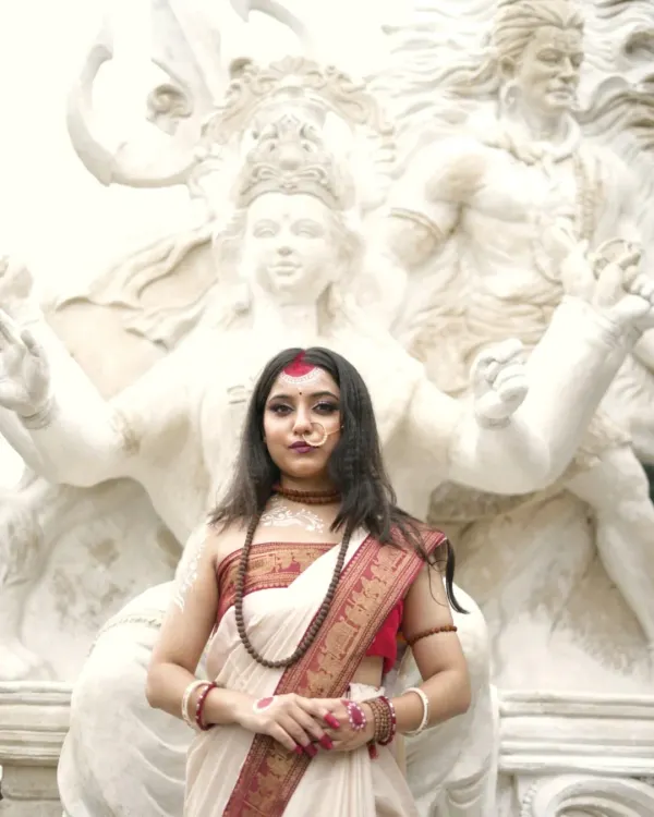 Embodying the divine feminine. This powerful portrait is from a conceptual series inspired by Goddess Parvati, capturing her strength and grace in front of a magnificent sculpture of Lord Shiva.