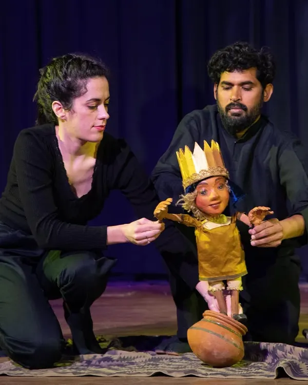 A dynamic scene from 'Buried Treasures' where our French and Indian artists interact with a puppet. This moment highlights the show's blend of live acting and puppetry to tell stories in a fresh, engaging way.