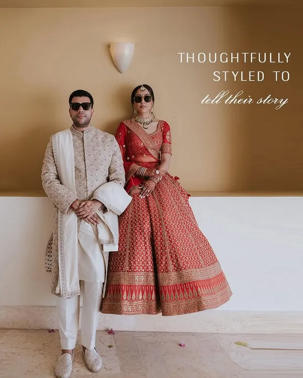 Two souls, one style story. For this couple, we paired a classic red Sabyasachi lehenga with a refined Anita Dongre sherwani, creating a look that is both traditional and powerfully modern.