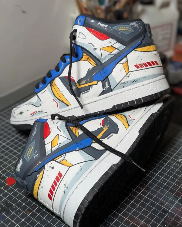 This custom Strike Freedom Gundam on a Nike Dunk High is one of the most detailed pieces I've ever done. It features a custom-built swoosh and battle-worn effects to make it look like it just walked off a battlefield. This is the level of detail I bring to every project.