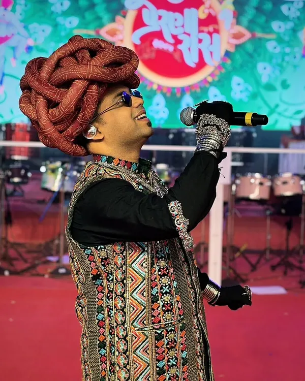 It's not just the outfit, but how you carry it. Sporting a traditional Rajasthani turban and an embroidered vest for a Navratri event, ready to bring the festive energy.