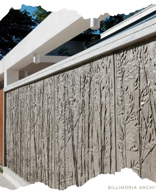 This exterior wall features a custom-designed, board-formed concrete texture with a bamboo motif. This technique transforms a simple boundary wall into a piece of art, adding a unique, tactile element to the architecture.