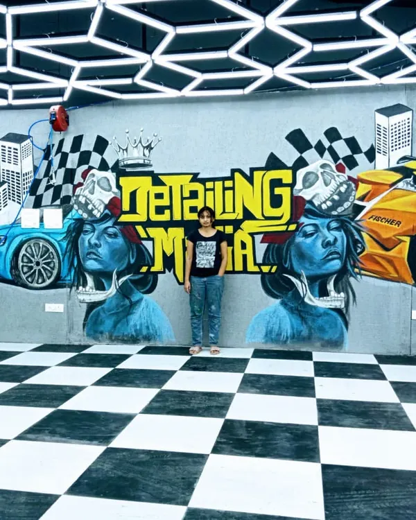 The finished graffiti mural for The Detailing Mafia, a luxury car garage. This huge 27-foot piece has a sporty, edgy theme and completely transforms the look of the workshop.