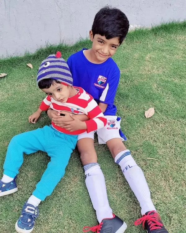 How it started. A beautiful moment between two brothers, with the older one, a long-time BYFL player, welcoming his little brother to the academy.