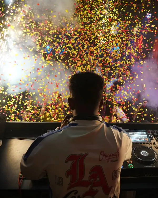 This is my view of the magic. I thrive on the energy of a packed dance floor, dropping beats that make the crowd erupt with excitement, complete with confetti and celebration.