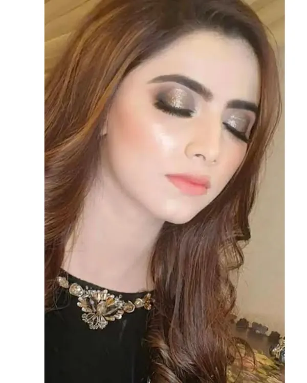 A perfect example of a pearly, shimmery eye makeup look. The metallic sheen on the eyelids creates a glamorous and eye-catching effect, ideal for evening events.