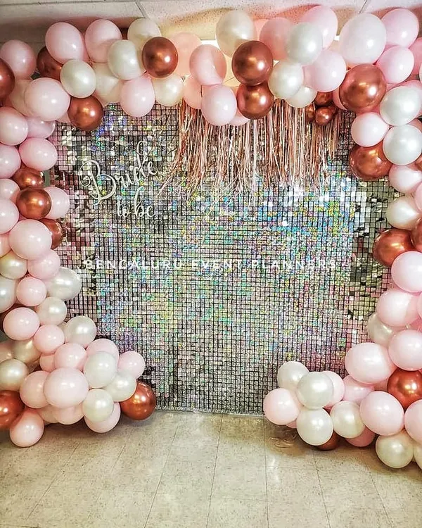 Here is a trendy and fun 'Bride to be' decoration I put together for a bridal shower. The shimmering sequin wall provides a glamorous photo backdrop, framed by a custom balloon arrangement in pink, white, and rose gold.