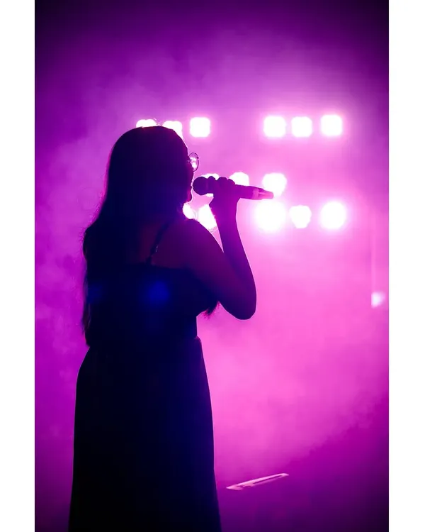 The stage is my happy place, where I feel most alive. This silhouette captures that feeling perfectly, just me, the music, and the lights. It’s a dream I get to live at every show.
