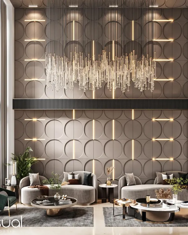 This duplex living room design showcases my ability to work with scale, using double-height walls, dramatic 3D paneling, and a statement crystal chandelier to create a sense of grandeur and modern luxury.