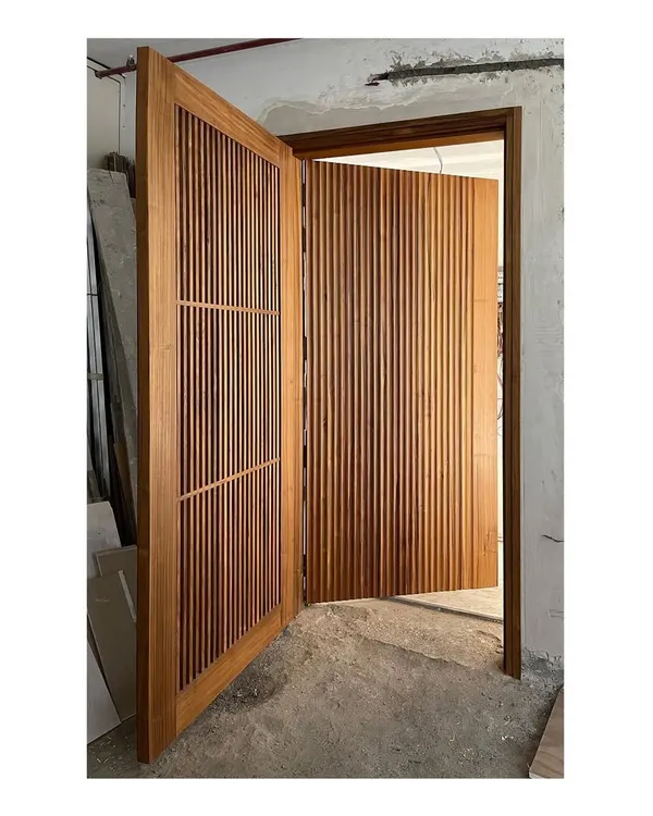 This solid teak entry screen and main door create a powerful first impression. I design entry interfaces that are not just doors, but handcrafted statements about the quality and care invested in the home.