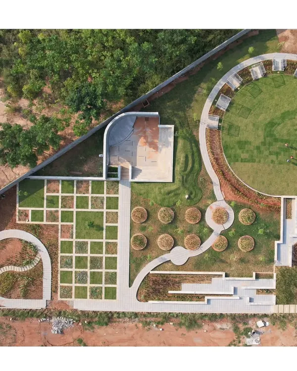 This aerial view captures the essence of my approach to a residential layout in Bangalore. I sculpt the ground to create a park with distinct zones for community gathering, quiet contemplation, and active play, ensuring the landscape is a central, living part of the development.