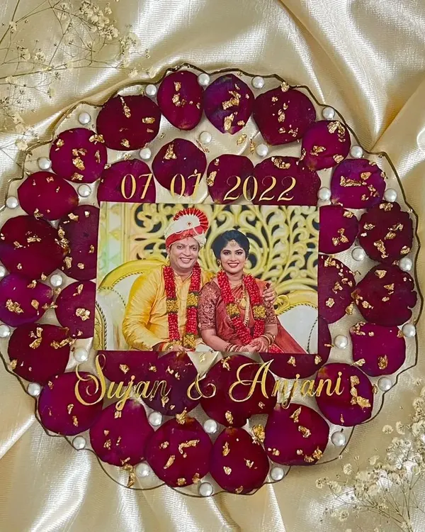 This custom 10-inch photo frame is one of my favorite ways to preserve precious memories. I carefully arranged this couple's wedding flowers and added their names and special date to create a keepsake they can cherish forever.