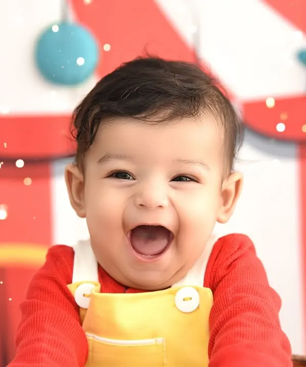 This is the kind of pure, uncontainable joy I love to capture. A fun circus-themed shoot is perfect for letting your little one's personality shine, and this close-up shot freezes that perfect giggle forever.
