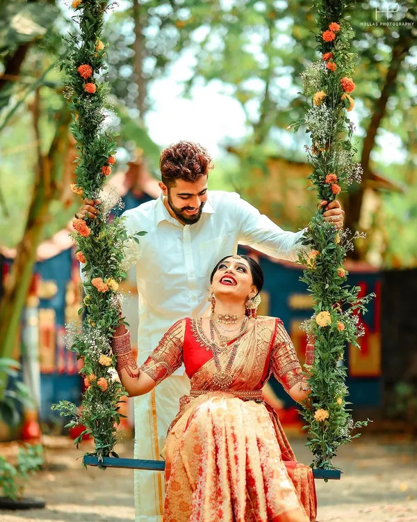A beautiful, happy moment on a floral swing from a unique Mantra Mangalya wedding.