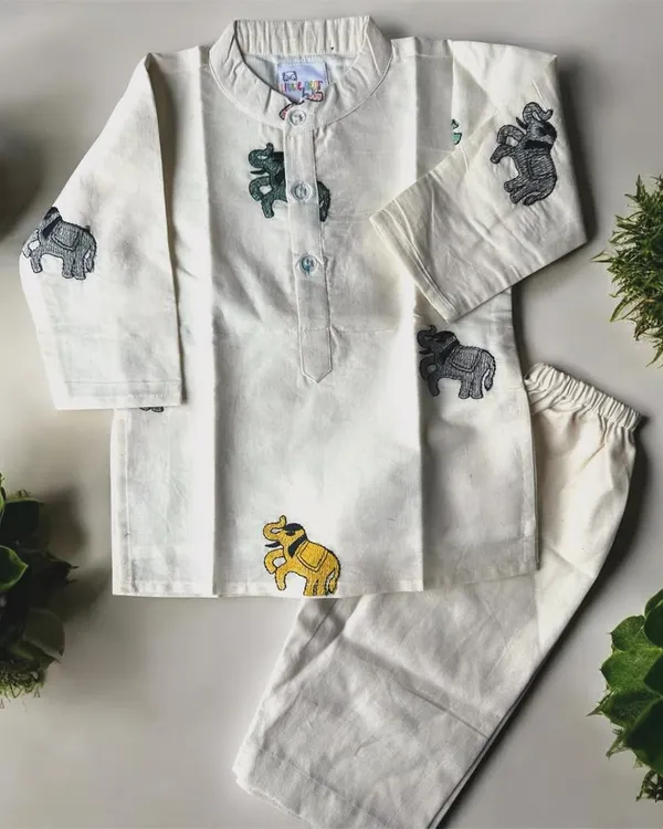 I love adding playful details to my boys' outfits. This off-white cotton kurta set features cute little embroidered elephants, making traditional wear fun for your little man. It’s simple, soft, and perfect for any celebration.