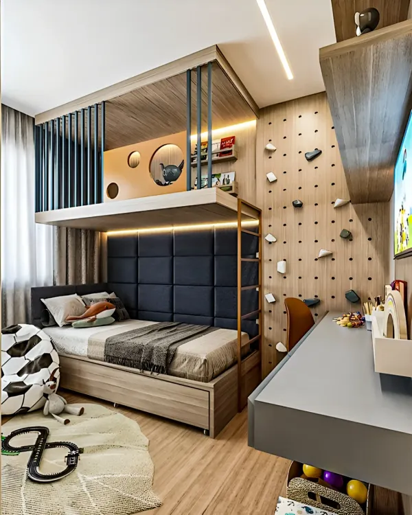 This kids' room is a masterclass in space efficiency. The loft bed frees up floor space for a study desk and play area, while the wall is utilized for a fun climbing activity.