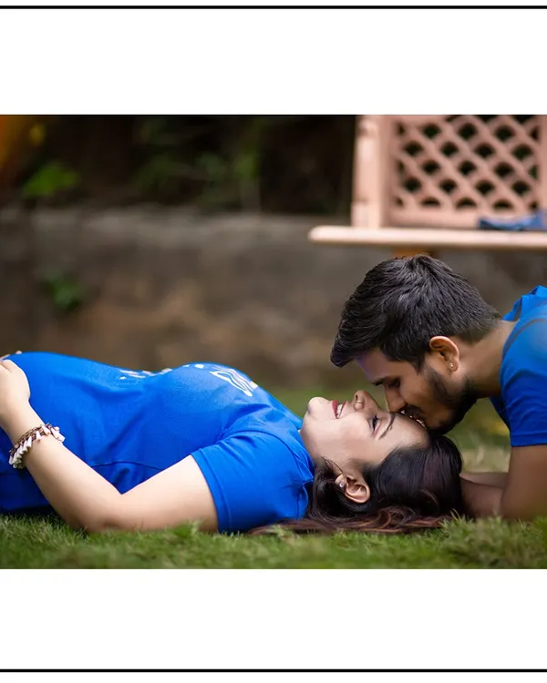A sweet and intimate moment, with the couple in casual clothes, lying on the grass. This style is perfect for capturing your natural connection.