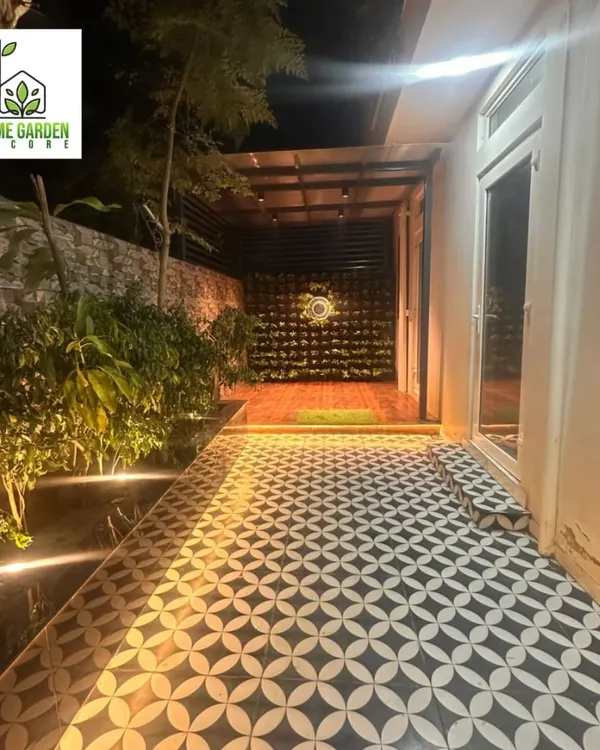 A complete backyard makeover. I designed and executed the entire project, including the patterned tile flooring, integrated lighting, vertical garden, and real plants.