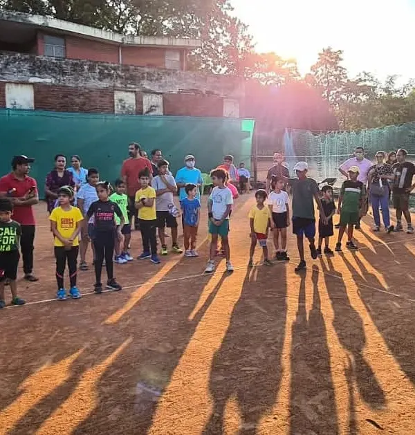 Our young players gathered on the court during a tournament weekend at our academy. This is where the journey begins, with Red and Orange ball matches for our youngest competitors.