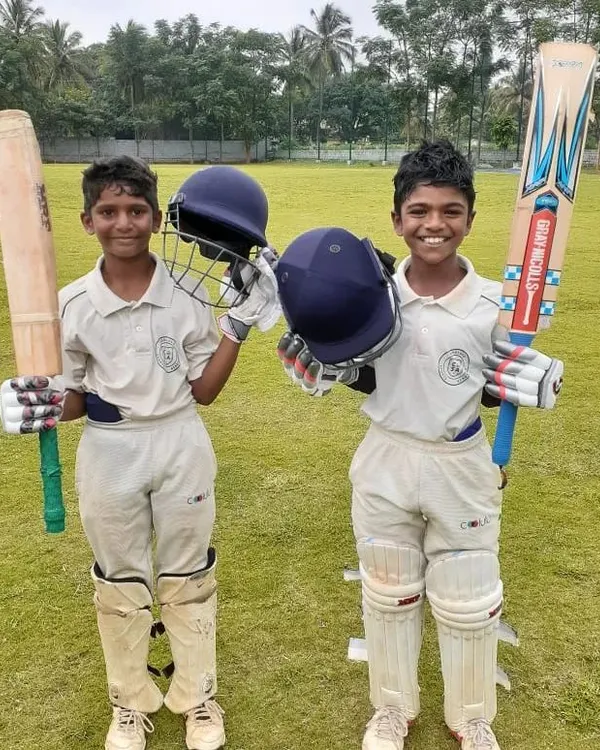 Future opening pair? Two of our young batsmen, fully kitted out and ready for action, showcasing the professional gear and confident attitude we instill in our players.