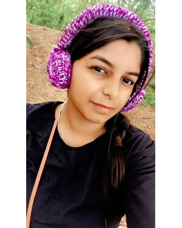 Give your headphones a unique and cozy makeover with my custom crochet headset covers. Here I am modeling a purple and white set.
