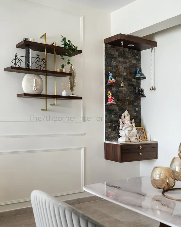 In alignment with Vaastu principles, I incorporated this dedicated pooja mandir into the dining area. The back panel features Spanish stone cladding, symbolizing stability and grounding.