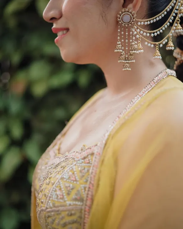 A close-up on the bride's stunning ear cuff, a piece of art in itself. We believe that capturing the details of your bridal jewelry is essential to telling the full story of your look.