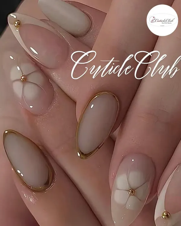 An incredibly chic and minimalist design. This set features a nude base with delicate gold borders and subtle, linear floral art.
