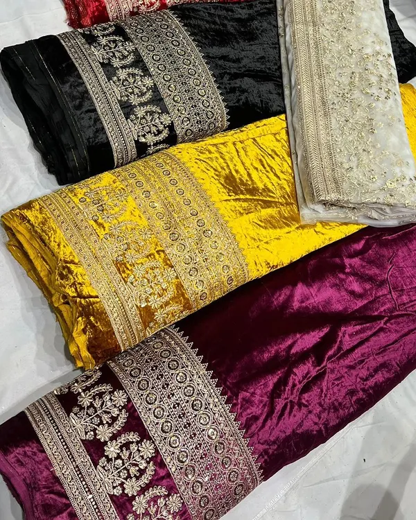 Here is a selection of my embroidered viscose velvet fabrics in rich jewel tones. You can see the heavy, intricate border work on the black, yellow, and maroon options, perfect for winter weddings.