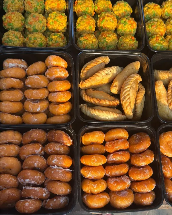 A glimpse of our colourful and delicious sweets prepared for Holi. I offer a wide variety, including traditional gujiyas, motichoor ladoos, and other treats, all packed fresh for your celebration.