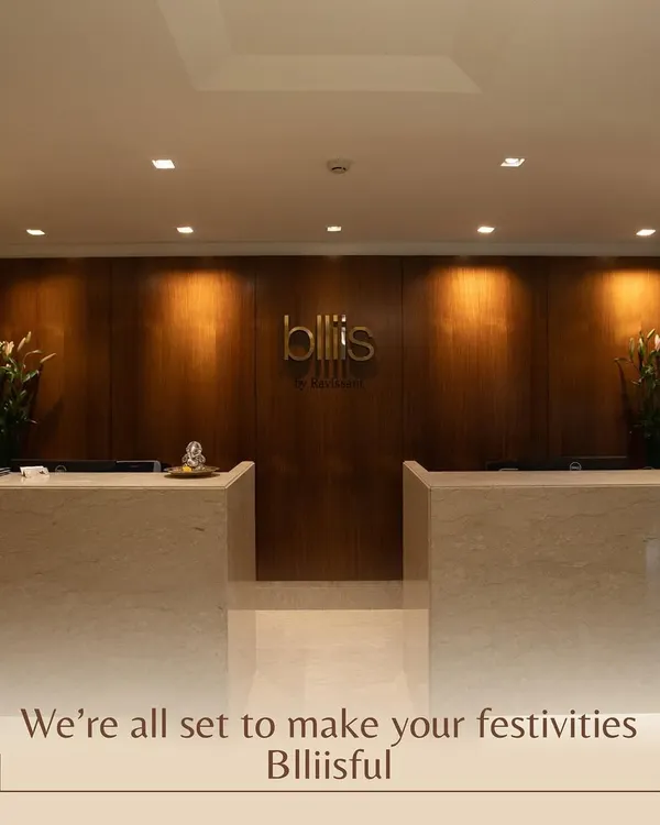 Your Blliisful experience starts here. Our elegant reception area, with its warm wood paneling and marble desks, sets a tone of sophisticated calm from the moment you walk in.