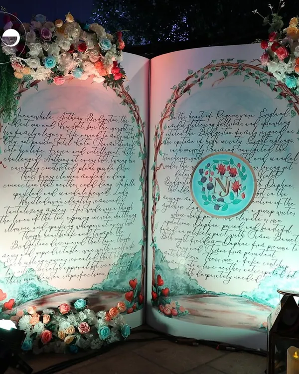 This larger than life storybook backdrop set the stage for a magical, Bridgerton inspired baby shower. I believe in creating immersive experiences, and this piece, with its hand painted calligraphy and floral arches, was the heart of the celebration.