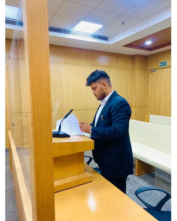Standing at the podium, presenting arguments in the courtroom. This is where preparation meets performance, and where I fight to make my client's voice heard.